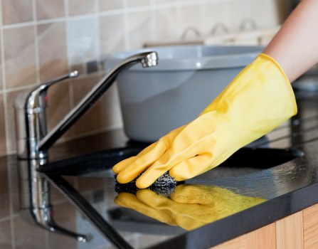 Kitchen cupboard and surface cleaning during a move-in service
