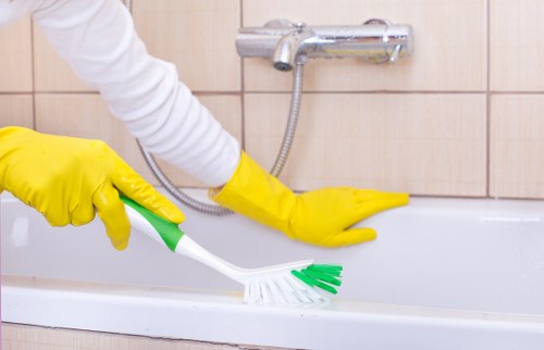 Professional home cleaning tasks in a South London kitchen and living space