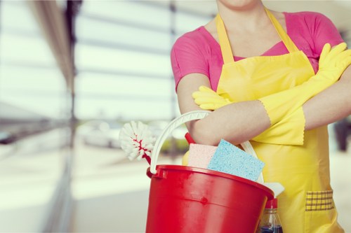 Local cleaner preparing a shared kitchen in Elephant and Castle